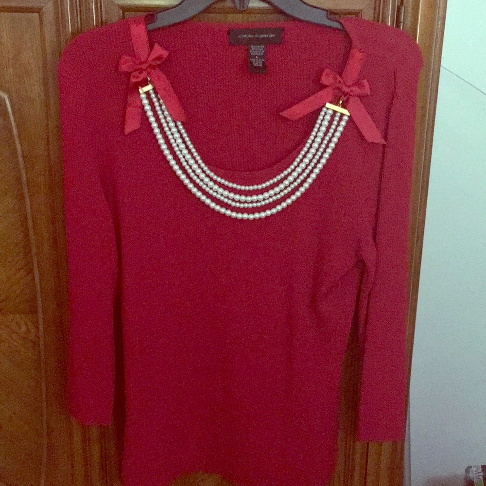 Red ribbed sweater with pearl accents